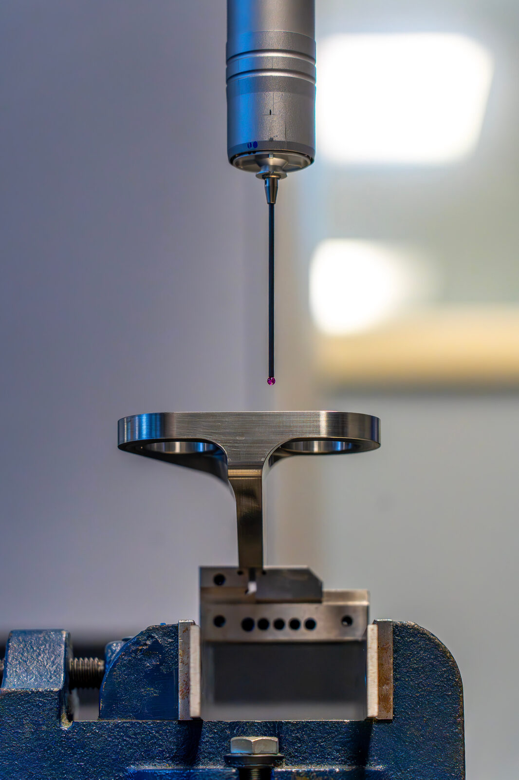 Precision-machined aerospace part undergoing inspection
