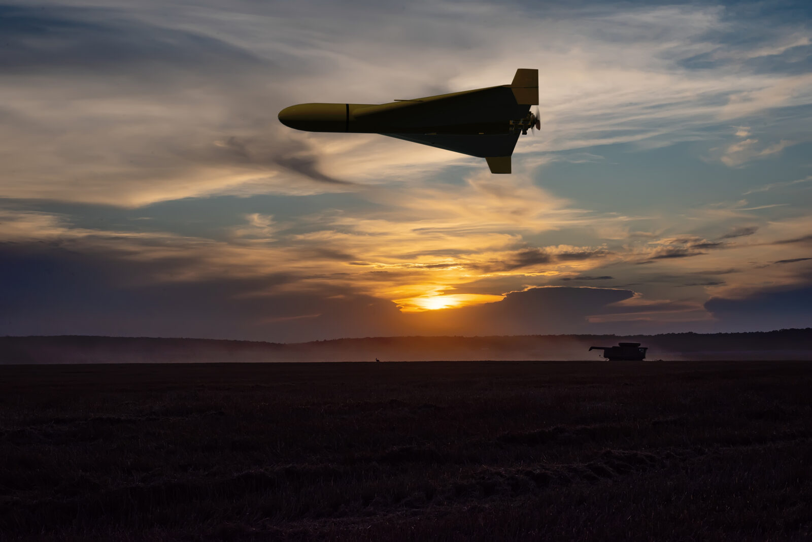 Military drone aircraft at sunset