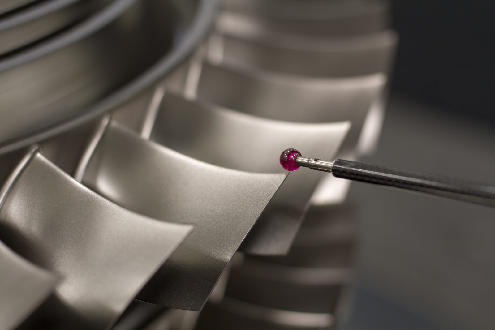 Precision inspection probe measuring machined turbine blades